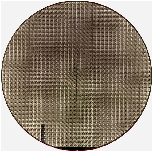 Fig. 3: Scratch made by a robot wafer handler that curves across the whole wafer (300 mm). Source: Microtronic